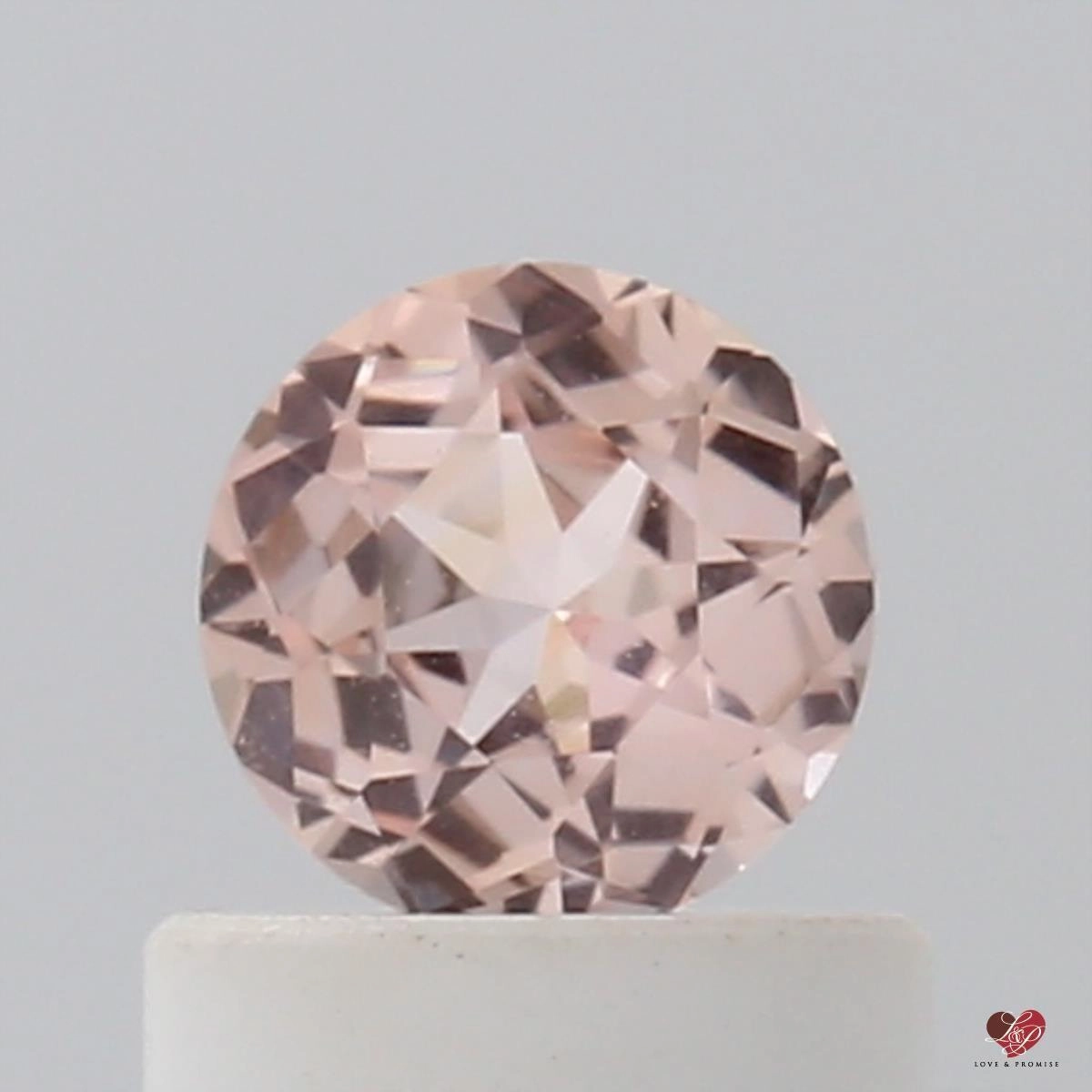 0.54cts Round Warm Peachy Blush Champagne Sapphire